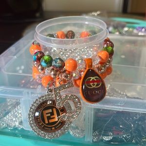 Beaded bracelets with luxury charms in rose gold.